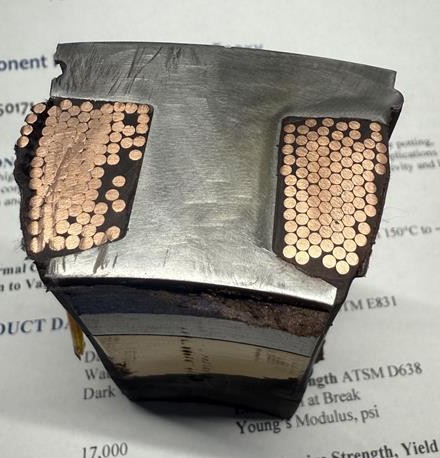 Cross-section sample used to evaluate resin impregnation into the coils